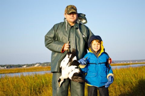 Father and son with eider