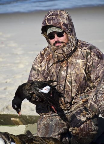Hunter with white winged scoter