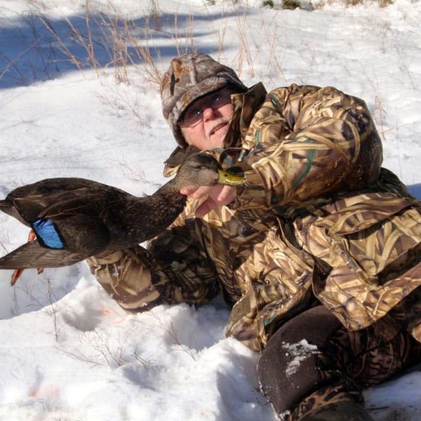 Hunter with black duck